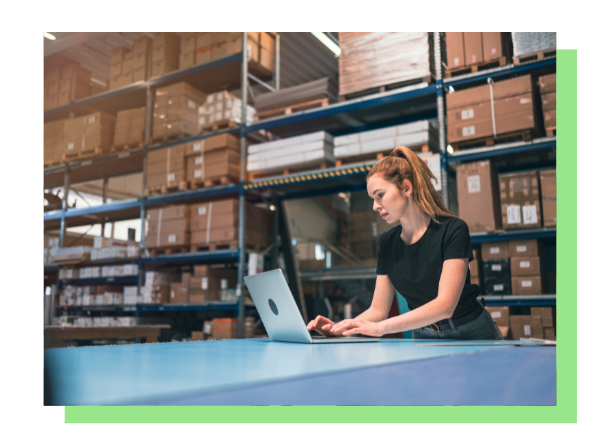 Woman on computer in front of boxes